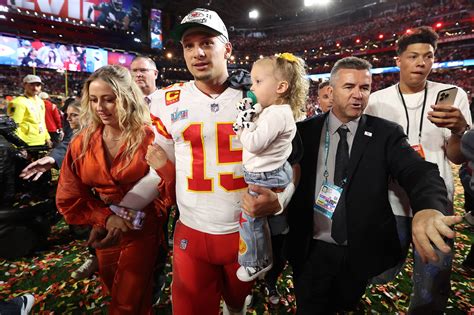 Patrick Mahomes kisses wife after Chiefs' Super Bowl 2023 win