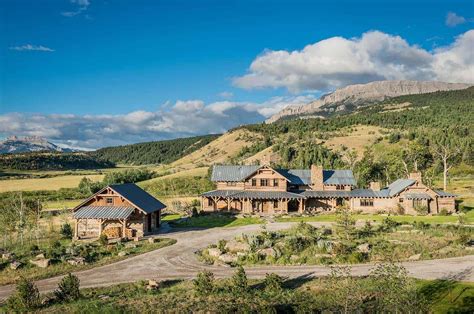 Rustic-modern mountain ranch nestled in the rugged Montana landscape ...