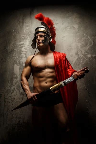 Muscular male warrior | Muscular male warrior posing showing his body — Stock Photo © fxquadro ...