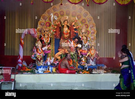 Devotees offer prayer at a community pandal during the Maha navami of Durga Puja, in Guwahati ...