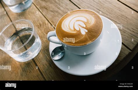 Closeup of barista made coffee with froth art Stock Photo - Alamy