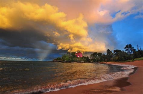 Free Photos: Marquette Lighthouse at sunset with thunderstorm clouds | dailyshot