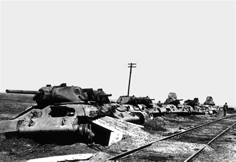 Asisbiz BARBAROSSA Soviet T-34,tanks,destroyed,near,a,railway,assembly,point,by,German,bombers,01