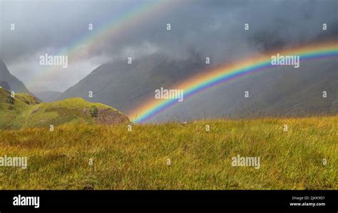 A natural landscape in Scotland, the United Kingdom with a rainbow Stock Photo - Alamy