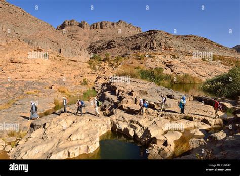 Algeria, Tassili N'Ajjer National Park, Group of people hiking in ...