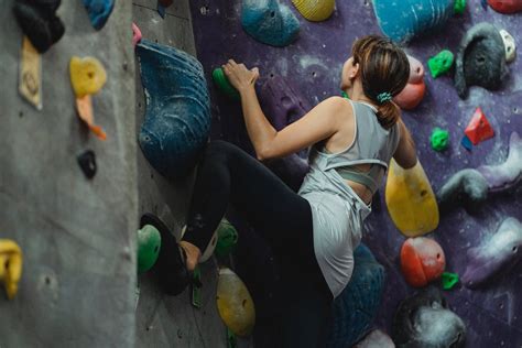 Unrecognizable climber climbing wall during workout · Free Stock Photo