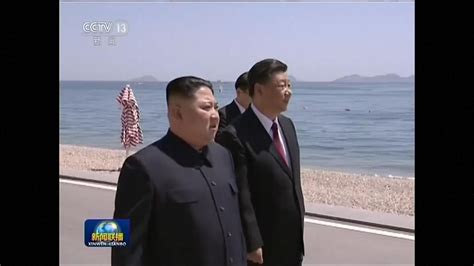 Kim Jong Un strolls along seaside with President Xi Jinping in China ...