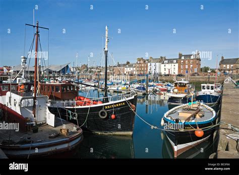 Arbroath Harbour in Scotland with vessels moored and Shore Street in the background Stock Photo ...