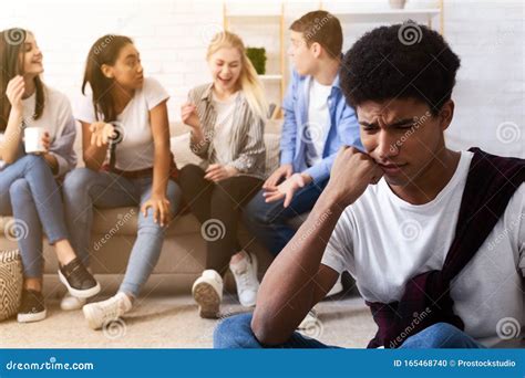 Bullying Concept. Sad Guy Avoiding Bad Friends Stock Photo - Image of excluded, people: 165468740