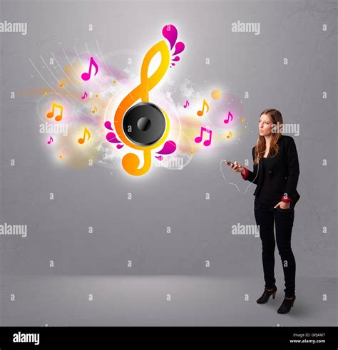 pretty girl singing and listening to music with musical notes Stock Photo - Alamy