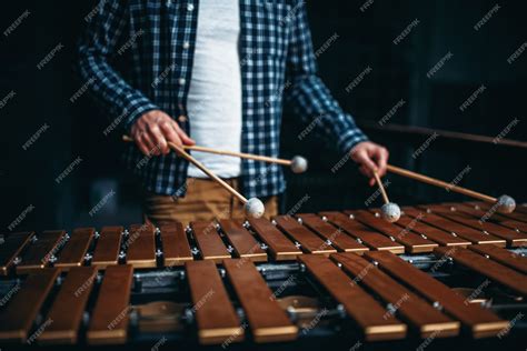 Premium Photo | Xylophone player hands with sticks, wooden sounds