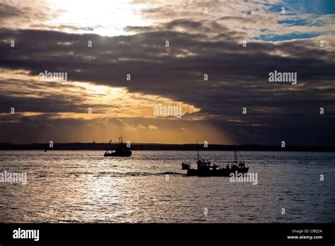 Portsmouth Harbour at sunset Stock Photo - Alamy