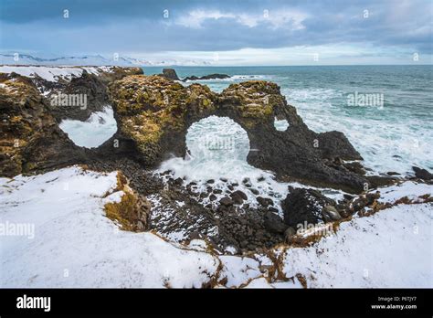 Arnarstapi, Snaefellsness peninsula, Western Iceland, Europe. The arch rock of Gatklettur in ...