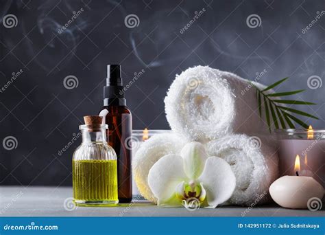 Aromatherapy, Spa, Beauty Treatment and Wellness Background with Massage Oil, Orchid Flowers ...