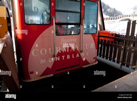 Red cable car in Courmayeur, Monte Bianco, Italy Stock Photo - Alamy