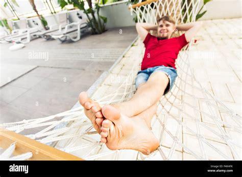 Man Relaxing In Hammock Stock Photo - Alamy