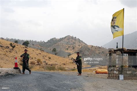 Kurdistan Worker's Party rebels man a security checkpoint on October ...