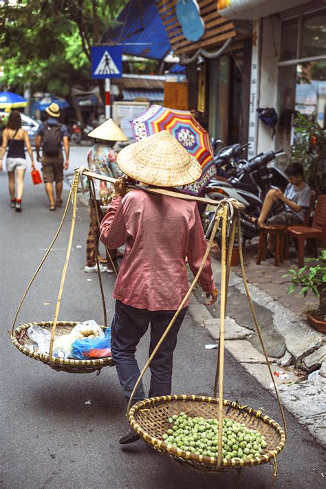 Vietnamese street market lady seller Hanoi Vietnam Photograph by Eduardo Huelin - Fine Art America