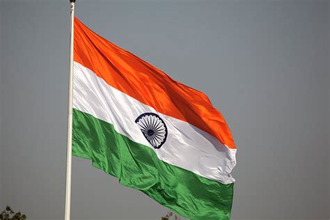 India New Delhi National Flag Flying From Flagpole by Christine Pemberton