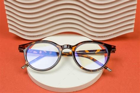 Stylish eyeglasses on a round podium. Leopard glasses Stock Photo by ...