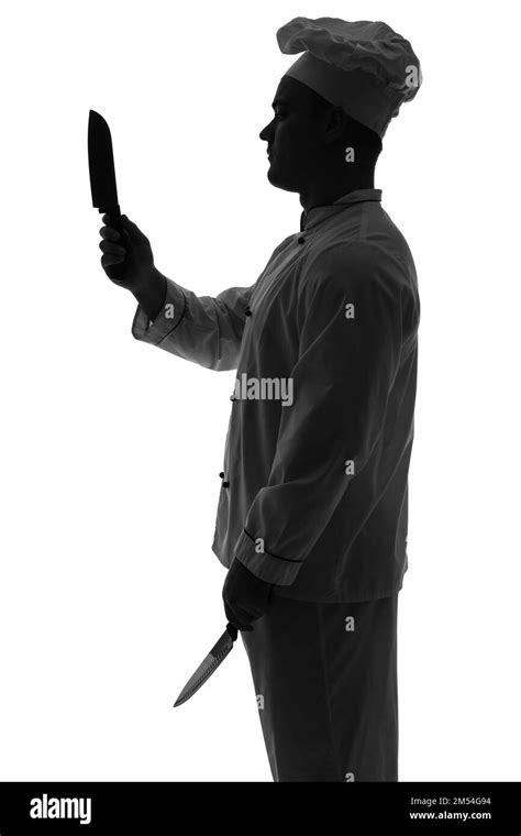 Silhouette of male chef with knives on white background Stock Photo - Alamy