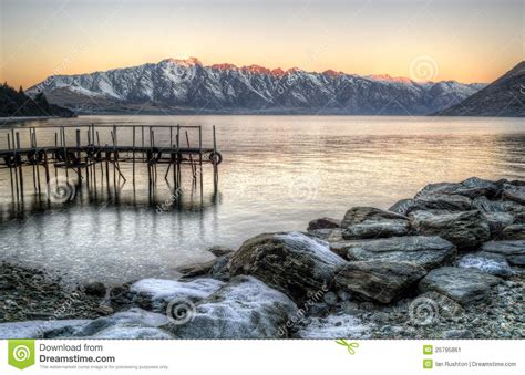 Jetty at sunset stock image. Image of mountains, frost - 25795861