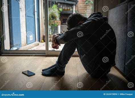 Depressed Man. Sad Unhappy Man Sitting on the Floor Stock Photo - Image ...