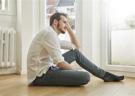 Man sitting on the floor stock photo