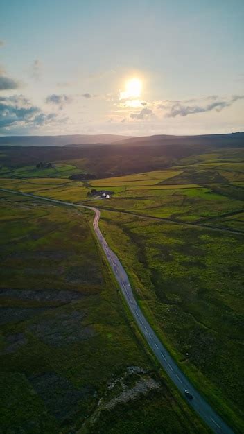 Premium Photo | Aerial view of a country road with a country road in ...