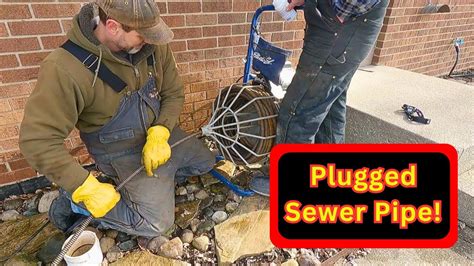 Plugged Sewer Pipe! - Using Electric Drain Auger To Clear A Sewer Line - YouTube