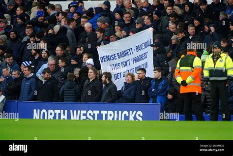 Everton fans hold up banners in protest against the clubs board ahead ...