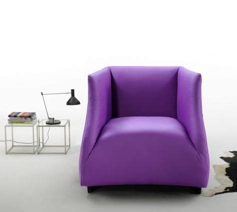 The Celia leather armchair is a stunning chair design with delicate curves that accentuate and ...