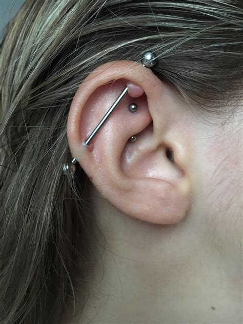 2 YEAR OLD INDUSTRIAL PIERCING. metal is implant grade titanium. it ...