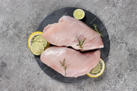 Premium Photo | Daging dada ayam mentah or raw chicken breasts with ...