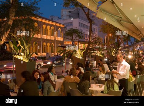 People sitting in an outdoor cafe in the evening, Archiepiskopou ...