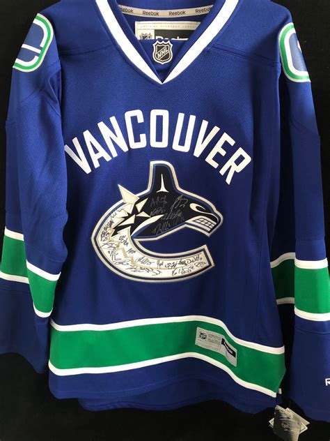 MULTI SIGNED VANCOUVER CANUCKS HOCKEY JERSEY