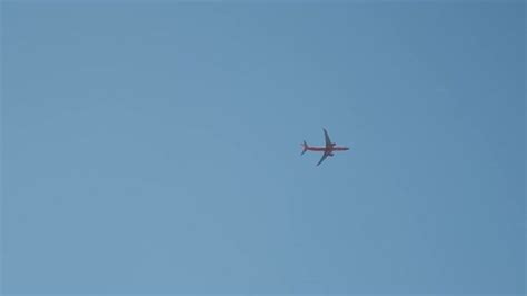 Plane Flying in Bright Blue Sky, Stock Footage | VideoHive