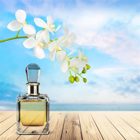 Premium Photo | Perfume bottle and flowers on background