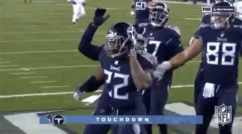 Cheering Derrick Henry Stiff Arm GIF | GIFDB.com