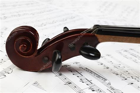 Violin scroll and music sheet — Stock Photo © alenavlad #59708353