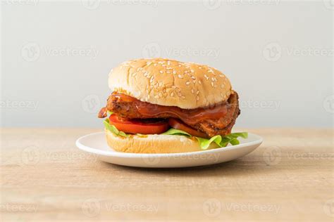 Grilled chicken burger with sauce on white plate 3006580 Stock Photo at ...