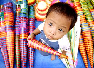 hats | A kid plays amidst colorful hats which doubles as noi… | Flickr