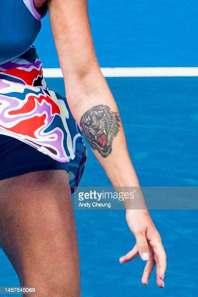 A tattoo of Aryna Sabalenka is seen in the round two singles match ...