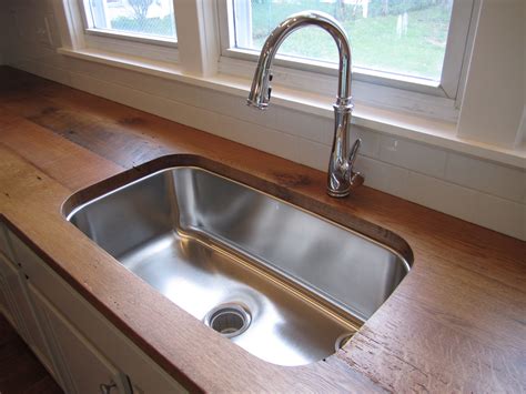 Reclaimed wood countertops in our new kitchen. Oak. 112 years old. Love.