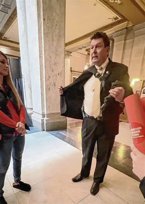 State Rep. Jim Lucas shows gun to students Tuesday at the Statehouse ...