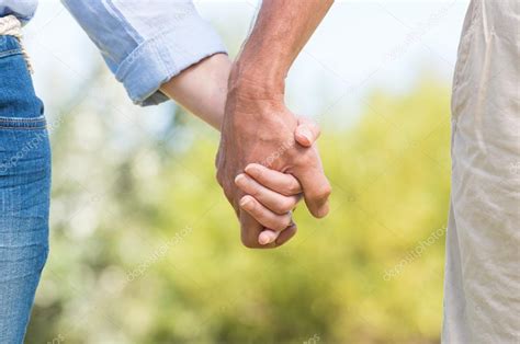 Couple holding hands — Stock Photo © ridofranz #109354172