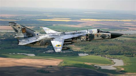 Thunderous Skies: HD Wallpaper featuring Sukhoi Su-24 Bomber