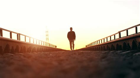 Man Walking At Sunset Stock Footage SBV-323374629 - Storyblocks