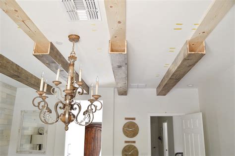 DIY Faux Wood Beams | Ceiling beams living room, Beams living room, Wood beam ceiling