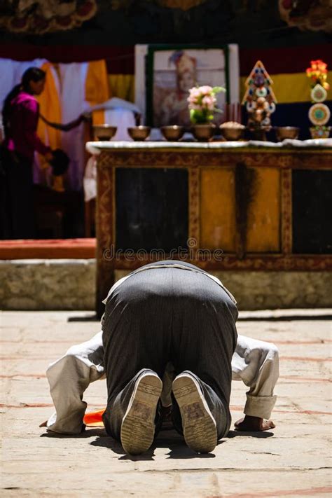 Vertical Shot of an Adult Tibetan Buddhist Worshiper in Prostration at ...